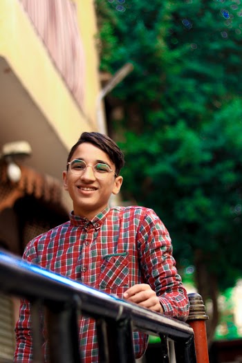 Macro Shot Photography Of Smiling Boy