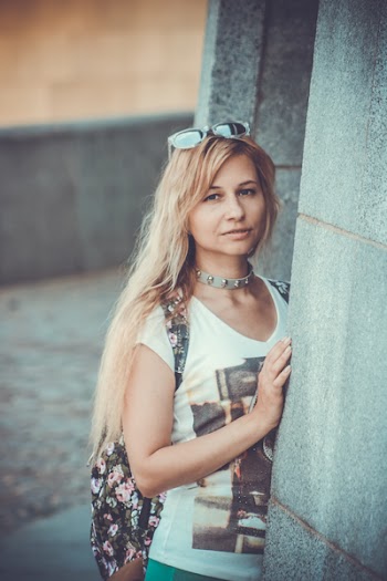 Macro Shot Photography of Woman Holding Wall