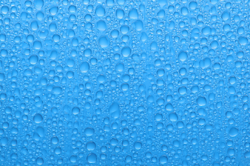 Macro Water Droplets on Blue Glass Surface
