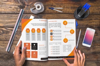 Magazine and smartphone mockup on wooden table with pens and rulers Free Psd