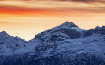 Majestic Snow-Capped Mountains at Sunset