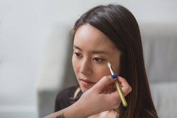 Makeup Artist Using Brush