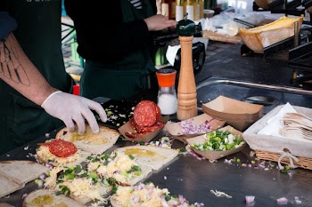 Making salami sandwiches 