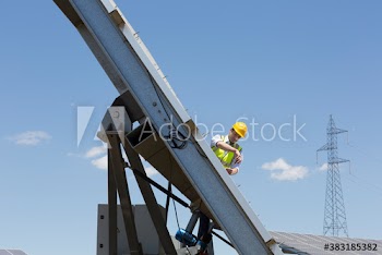 Male engineer fixing solar panel