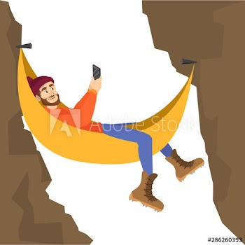 Male mountain climber resting in the hammock