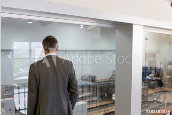 Male supervisor watching factory floor