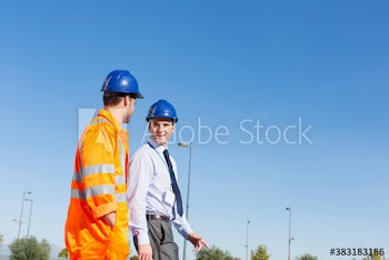 Male worker and manager walking and talking