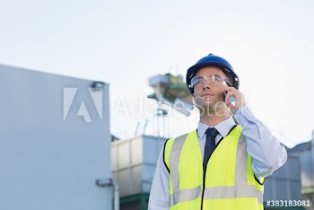 Male worker using smart on dairy farm