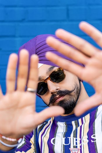 Man's Face Through Triangle Hand Gesture