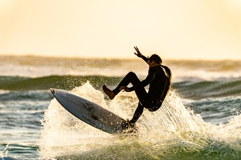 Man About to Wipeout of his Surfboard