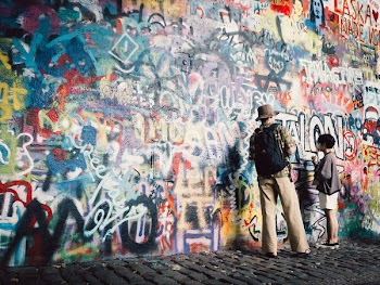 Man and Boy Painting the Wall