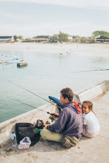 Man and Child Fishing