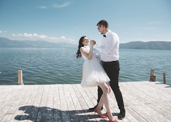 Man and Woman Dancing on Dock