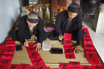 Man and Woman Doing Calligraphy