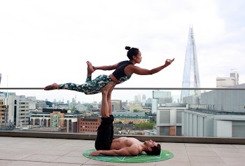 Man And Woman Doing Yoga