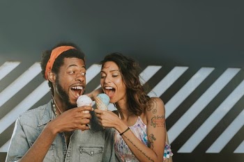 man and woman eating icecream