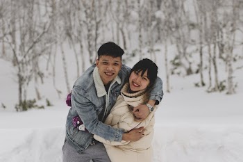 Man and Woman Embracing Each Other on Winter Outdoors