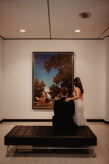 Man And Woman Facing A Painting