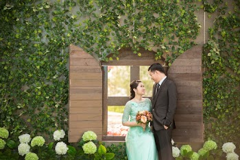 Man and Woman Facing Each Other Beside Glass Window