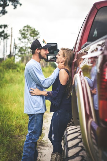 Man And Woman Facing Each Other In Shallow Focus Photography