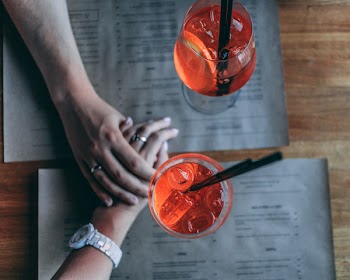 Man and Woman Holding Each Other's Hands