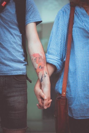 man and woman holding hands