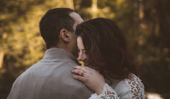 man and woman hugging each other during daytime