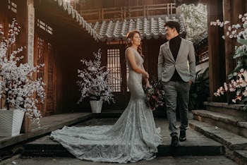 Man and Woman in Grey Dress and Suit