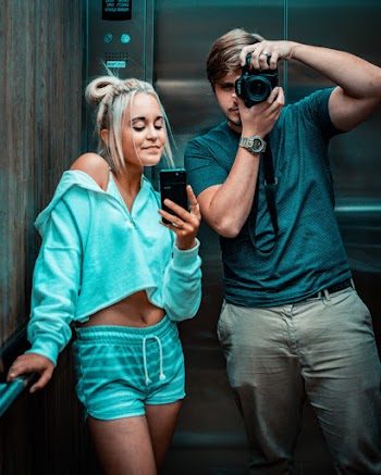 Man and Woman Inside Elevator