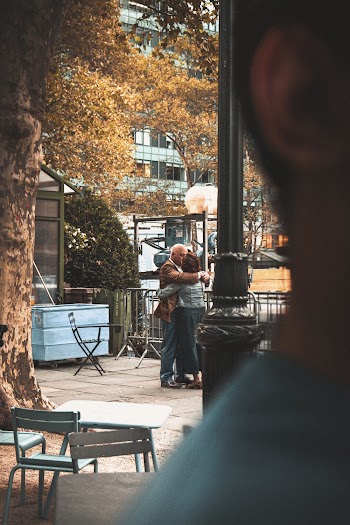 Man and Woman Kissing at a Park