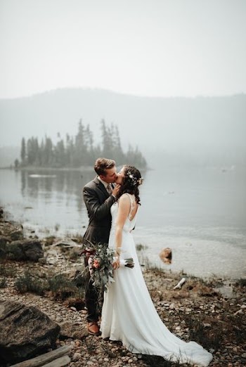 man and woman kissing during wedding