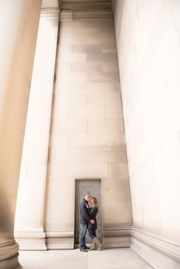Man and Woman Kissing Inside Building Near Door
