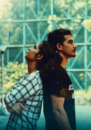 Man and Woman Leaning on Each Other