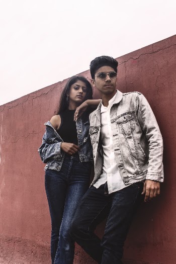 Man and Woman Leaning on Wall