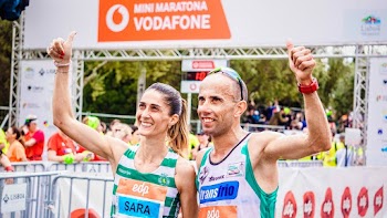 Man and Woman Making Thumbs Up Hand Sign