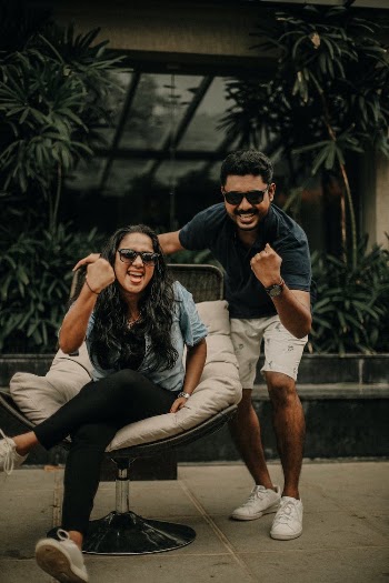 Man and Woman on a Terrace Expressing Excitement