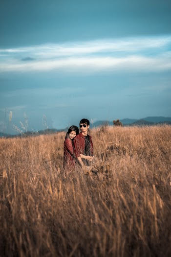 Man and Woman on Grass Field