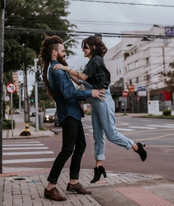 Man and Woman on road embracing each other  