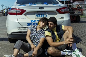 Man And Woman Posing Behind A Car