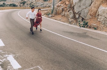 Man and Woman Running in Highway