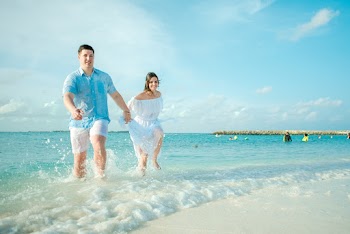 Man and Woman Running on Seashore