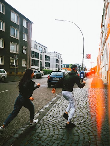 Man and Woman Running Outdoors