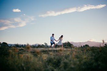 Man and Woman Running While Holding Hands