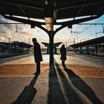 Man and Woman Silhouette Standing on Brown Ground at Daytime