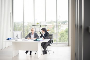 Man and Woman Sitting at the Table