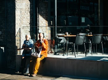 Man and Woman Sitting Beside Each Other