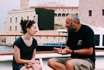 Man and Woman Sitting Near Structure
