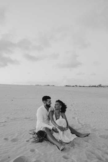 Man and Woman Sitting on Beach · Free Stock Photo