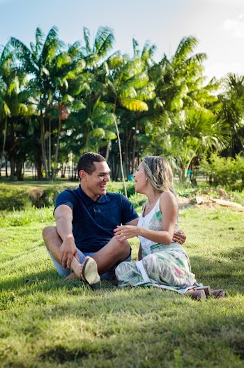 Man and Woman Sitting On Grass