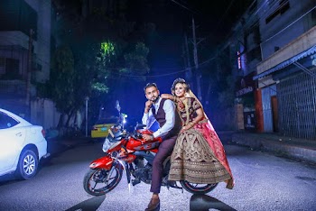 Man And Woman Sitting On Motorcycle